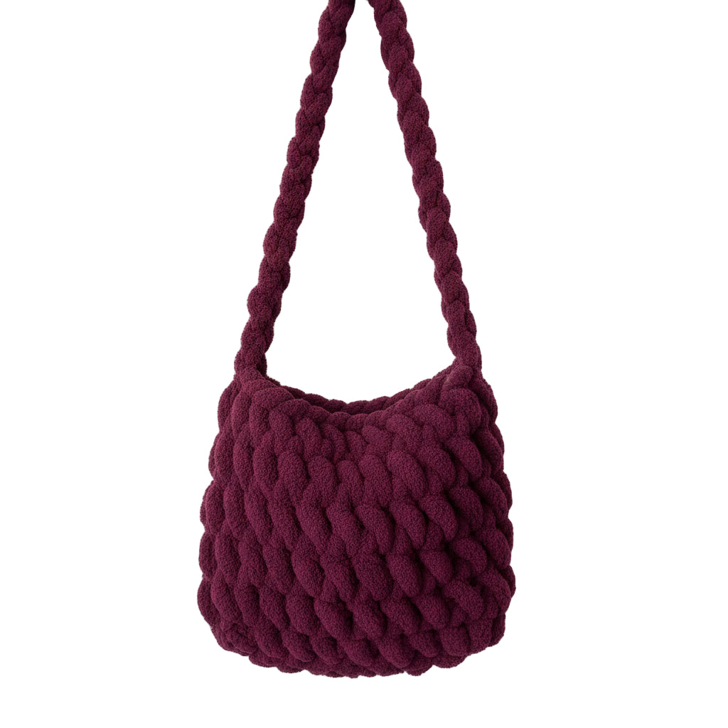 Purple knitted bag on a mannequin with a white background